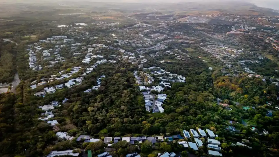 Aerial view of homes and coastal forest at Dunkirk Estate