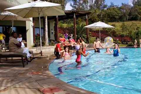 Clubhouse swimming pool at Palm Lakes Family Estate